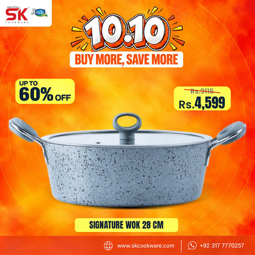 A promotional product graphic for a SK Cookware 28 cm signature wok. The wok has a speckled light gray exterior and a silver metallic interior, shown against a vibrant orange and yellow background with sale text overlays.