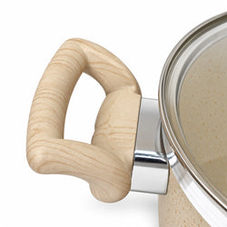 Close-up of a beige speckled pot with a curved light wood handle and a shiny silver metal collar, shown on a white background.
