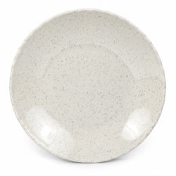 A round ceramic plate with a textured, speckled glaze in a warm off-white or cream color, featuring subtle gray-blue speckles and a scalloped rim, shown on a plain white background.