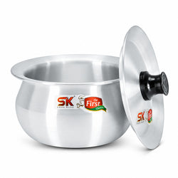 A stainless steel cooking pot with its matching lid leaning against it on a white background. The pot features the SK Cookware logo and 'the First Choice' branding on the front, and the lid has a black handle.