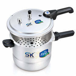 A stainless steel pressure cooker with black handles and a lid, featuring SK Cookware branding and 'the First Taste' logo on a white background.