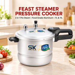 A silver and black SK First Choice Feast Steamer Pressure Cooker placed on a kitchen countertop with vegetables and a blurred kitchen background. Text at the top reads 'FEAST STEAMER PRESSURE COOKER' with additional product details.