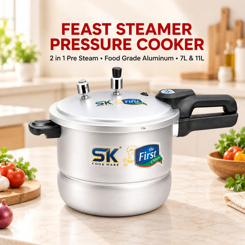 A silver and black SK First Choice Feast Steamer Pressure Cooker placed on a kitchen countertop with vegetables and a blurred kitchen background. Text at the top reads 'FEAST STEAMER PRESSURE COOKER' with additional product details.